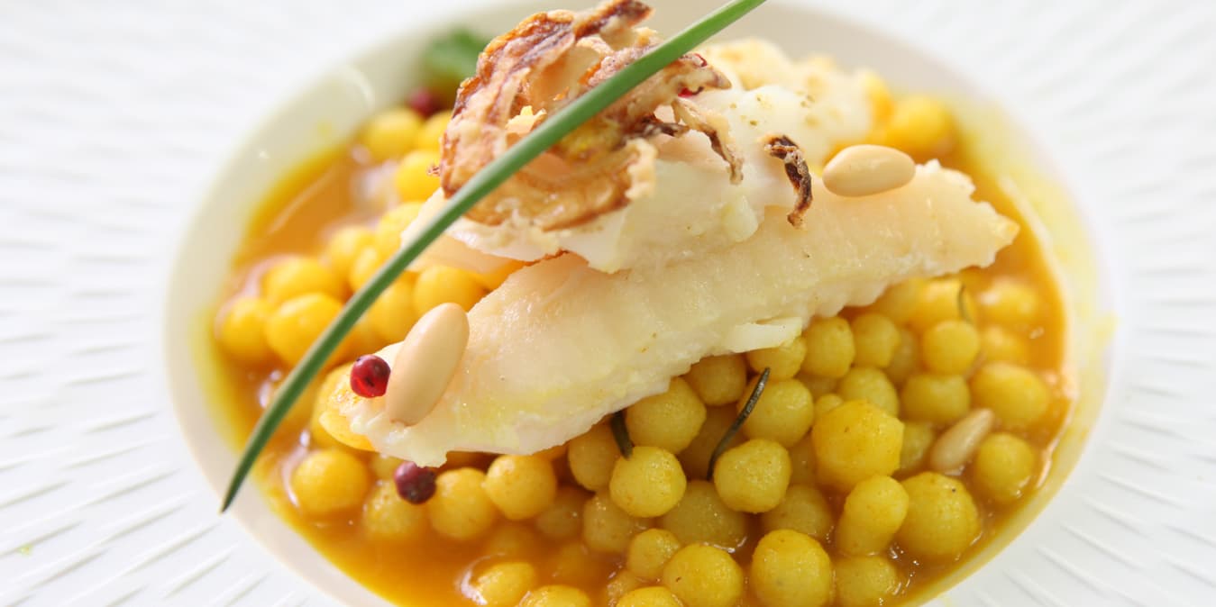 Chef Joe Barza plating a signature dish